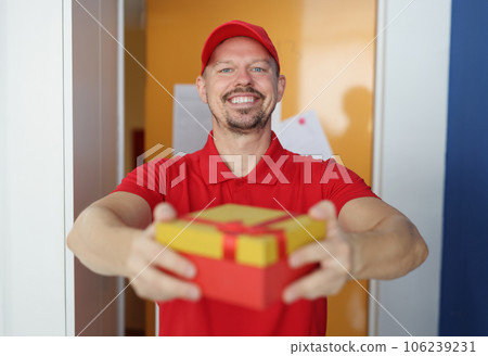 Smiling male courier brought handy cork to client 106239231