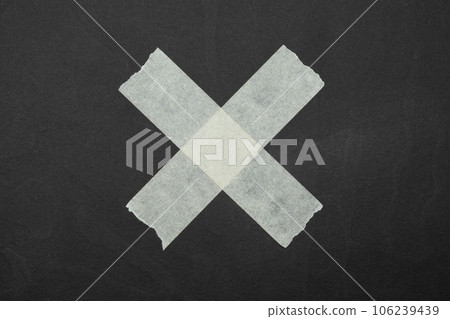 cross, close up of an adhesive tape 106239439