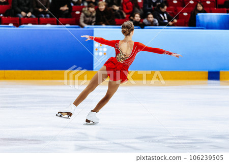 figure skating single, back girl figure skater in red dress figure skating single, back girl figure skater in red dress 106239505