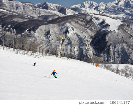 Hakuba Happoone Ski Resort Skiers skiing on the Risen Slalom course 106241177