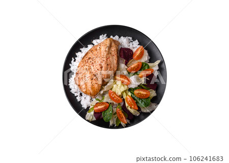 Delicious healthy breakfast consisting of chicken, rice, greens and cherry tomatoes 106241683