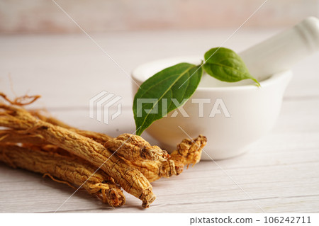Ginseng roots and green leaf, healthy food. 106242711
