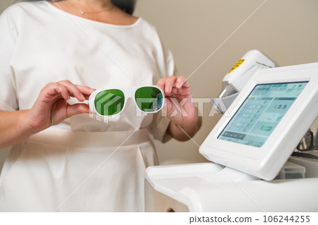 Close up protective goggles and laser epilation instrument for hair removal. Close up protective goggles and laser epilation instrument for hair removal. 106244255