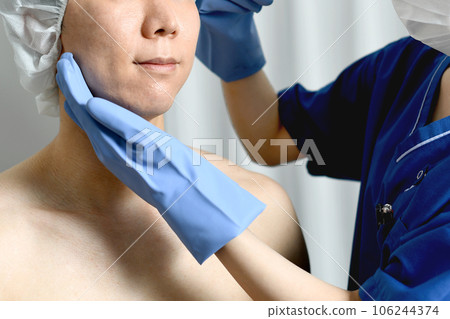 Young man receiving cosmetic injection at plastic surgery Young man receiving cosmetic injection at plastic surgery 106244374