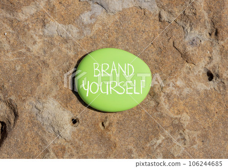 Brand yourself symbol. Concept words Brand yourself on beautiful green stone. Beautiful brown stone background. Business brand yourself concept. Copy space. 106244685