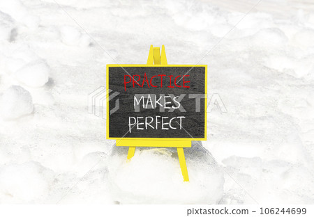 Practice makes perfect symbol. Concept words Practice makes perfect on beautiful black chalk blackboard. Beautiful snow background. Business practice makes perfect concept. Copy space. 106244699