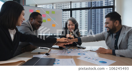 Business people diversity ethnicity stack touch arms palms together celebrating promotion reward, succeed common aim. Give high five symbol of unity 106245493