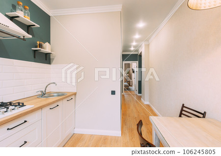 Modern Bright Kitchen In Scandinavian Stylish. Stylish Apartment Interior Of Kitchen, Kitchen Equipment. Family Apartment With Dinner Table And Chairs. Idea For Home Design. Light Colors Of Design 106245805
