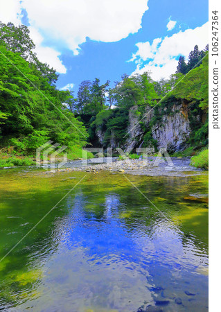 The clear stream Natori River reflecting the blue sky on the surface of the water 106247364