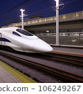 Shinkansen stopping at a station at night 106249267