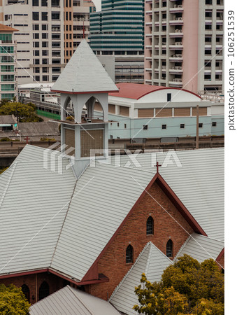 The Christian Church is sourrounded with modern architectural exterior buildings. The Christian Church is sourrounded with modern architectural exterior buildings. 106251539