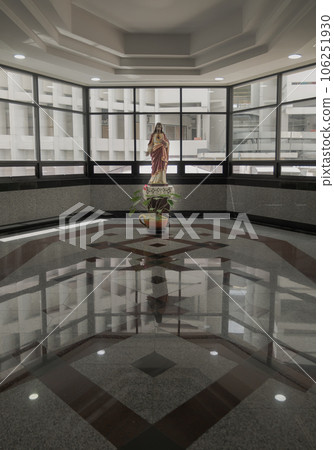 Jesus Christ Statue which is on the wooden platform in front of the glass wall. Jesus Christ Statue which is on the wooden platform in front of the glass wall. 106251930