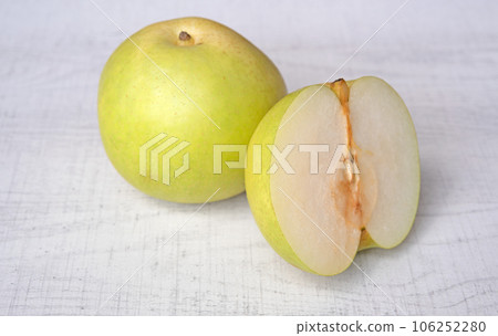 Japanese pear on wooden background. Sweet japanese fruit in autumn. Japanese pear on wooden background. Sweet japanese fruit in autumn. 106252280