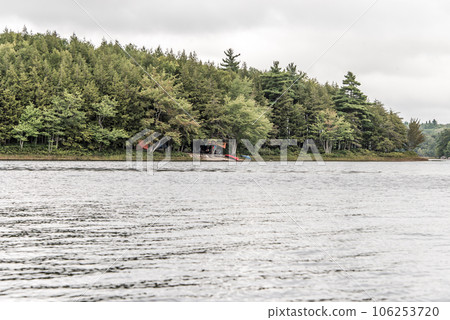 Canoe ride on river and islands in morning mist at Kejimkujik National Park Designated Wilderness Nova Scotia Canada 106253720
