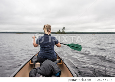 blonde Girl Canoe ride exploring nature on morning mist Kejimkujik National Park Wilderness Nova Scotia Canada blonde Girl Canoe ride exploring nature on morning mist Kejimkujik National Park Wilderness Nova Scotia Canada 106253722