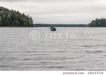 Canoe ride on river and islands in morning mist at Kejimkujik National Park Designated Wilderness Nova Scotia Canada 106253726
