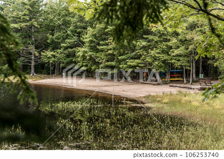 Canoe ride lending on river islands in morning mist at Kejimkujik National Park Designated Wilderness Nova Scotia Canada Canoe ride lending on river islands in morning mist at Kejimkujik National Park Designated Wilderness Nova Scotia Canada 106253740