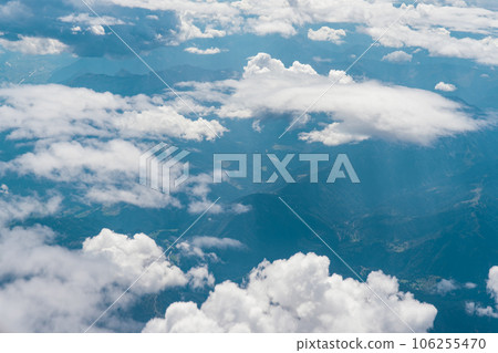 White cloudscape and mountainous landscape seen from high altitude White cloudscape and mountainous landscape seen from high altitude 106255470