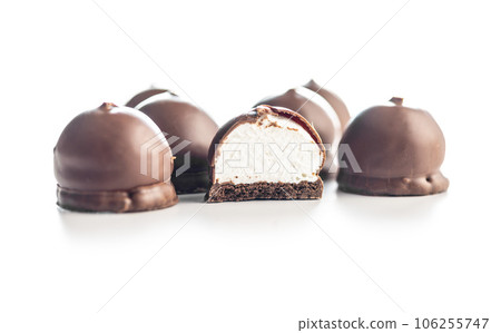 Chocolate covered marshmallows. Sweet dessert isolated on white background. 106255747