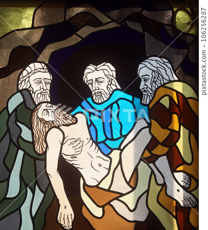 14th Stations of the Cross, Jesus is laid in the tomb and covered in incense, stained-glass window in the church of St. John the Baptist in Rijeka, Croatia 106256287