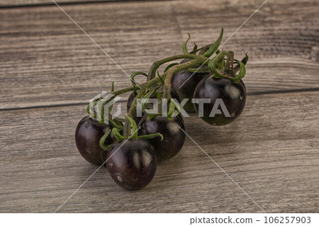 Ripe tasty black cherry tomato Ripe tasty black cherry tomato 106257903