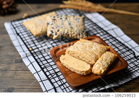 Slice of tempeh on kitchen tabletop. Traditional food of Indonesia, healthy vegetarian food 106259015