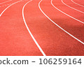red running track on athletic stadium background texture 106259164