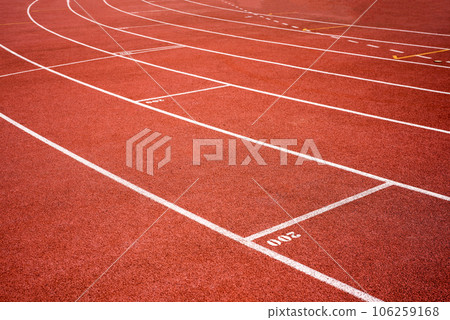 red running track on athletic stadium background texture 106259168