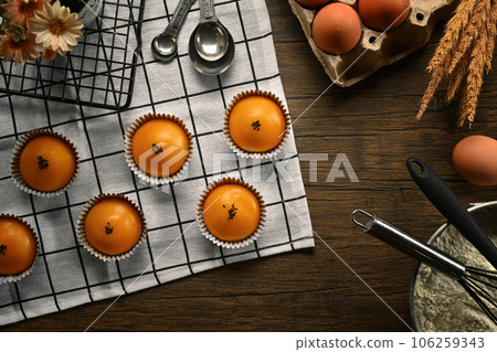 Traditional dessert for Chinese Mid-Autumn festival. Chinese pastry with stuffed salted yolk on wooden kitchen table Traditional dessert for Chinese Mid-Autumn festival. Chinese pastry with stuffed salted yolk on wooden kitchen table 106259343
