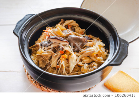 Mushroom rice cooked in a clay pot Mushroom rice cooked in a clay pot 106260415