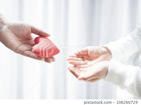 Handing over two hearts 106260729