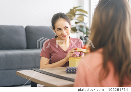 Southeast asian adult people couple give a gift box for anniversary or holidays event 106261714