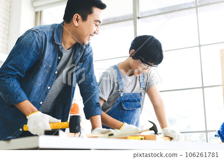 Southeast asian family father and son living together homeschooling 106261781