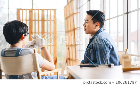 Southeast asian family father and son diy or repair for crafts skill at home workshop 106261787