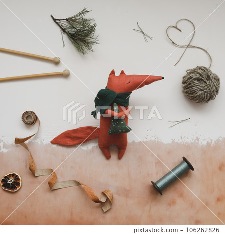 Christmas composition. Toy fox and decorations. Christmas, winter, new year concept. Flat lay, top view, copy space Christmas composition. Toy fox and decorations. Christmas, winter, new year concept. Flat lay, top view, copy space 106262826