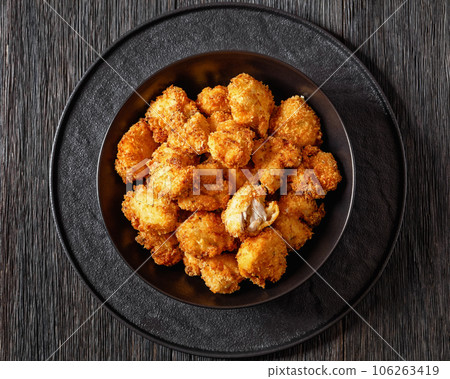 crispy fried panko breaded chicken bites in bowl 106263419