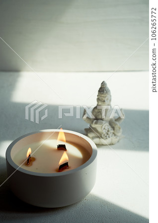 Goddess Lakshmi and a candle with three wooden wicks. Esotericism, religion. Abundance 106265772