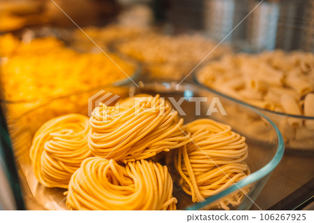 Traditional Italian fresh made colorful organic pasta in shop window. Italian food at a farmer's market in Pisa, Italy. Traditional Italian fresh made colorful organic pasta in shop window. Italian food at a farmer's market in Pisa, Italy. 106267925