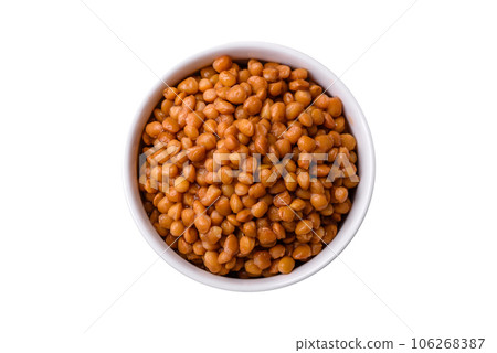 Delicious healthy canned lentils in a ceramic ribbed white bowl 106268387