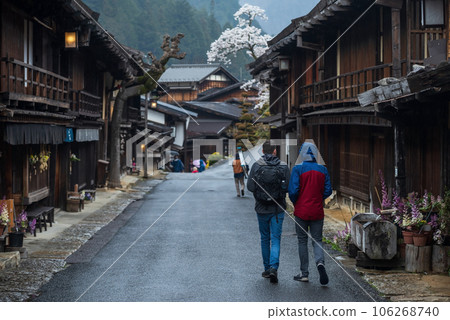 LGBT couple walk along preserved town, Tsumago juku, Kiso valley 106268740