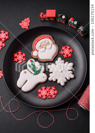 Beautiful festive Christmas gingerbread made by hand with decoration elements 106270154