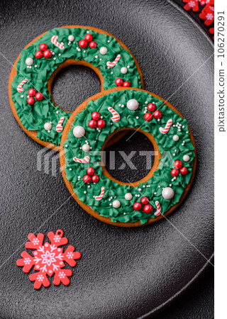 Beautiful festive Christmas gingerbread made by hand with decoration elements 106270291