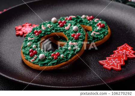Beautiful festive Christmas gingerbread made by hand with decoration elements 106270292