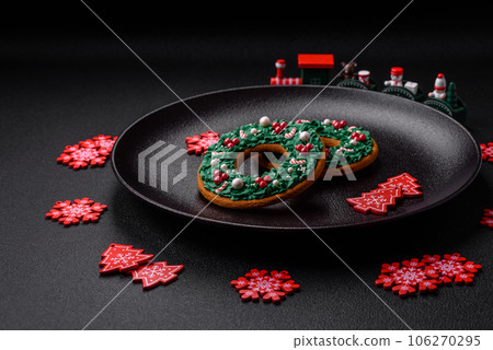 Beautiful festive Christmas gingerbread made by hand with decoration elements 106270295