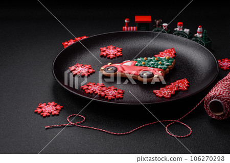 Beautiful festive Christmas gingerbread made by hand with decoration elements 106270298