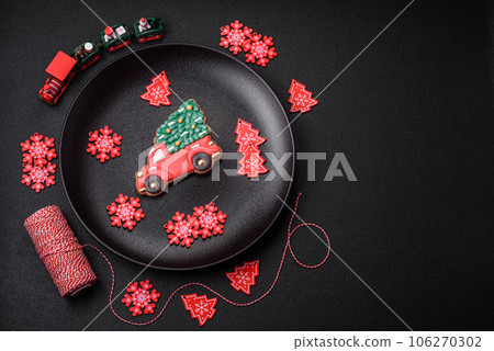 Beautiful festive Christmas gingerbread made by hand with decoration elements 106270302
