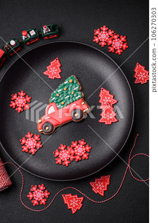 Beautiful festive Christmas gingerbread made by hand with decoration elements 106270303