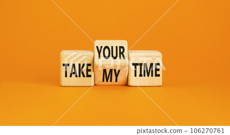 Take your or my time symbol. Concept words Take your or my time on wooden cubes. Beautiful orange table orange background. Business and Take your or my time concept. Copy space. 106270761