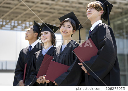 A female student looking at the camera in an academic gown Graduation ceremony image 106272055