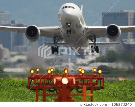 Passenger plane taking off with guide lights shining Passenger plane taking off with guide lights shining 106273240